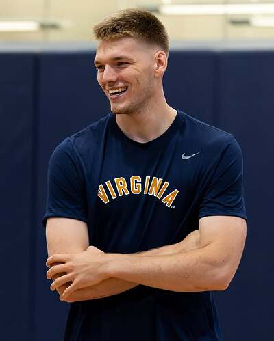 Photo by Virginia Men's Basketball on July 30, 2025. May be an image of 1 person, playing basketball, playing volleyball and text that says 'VIRG VIRGINA INA'.